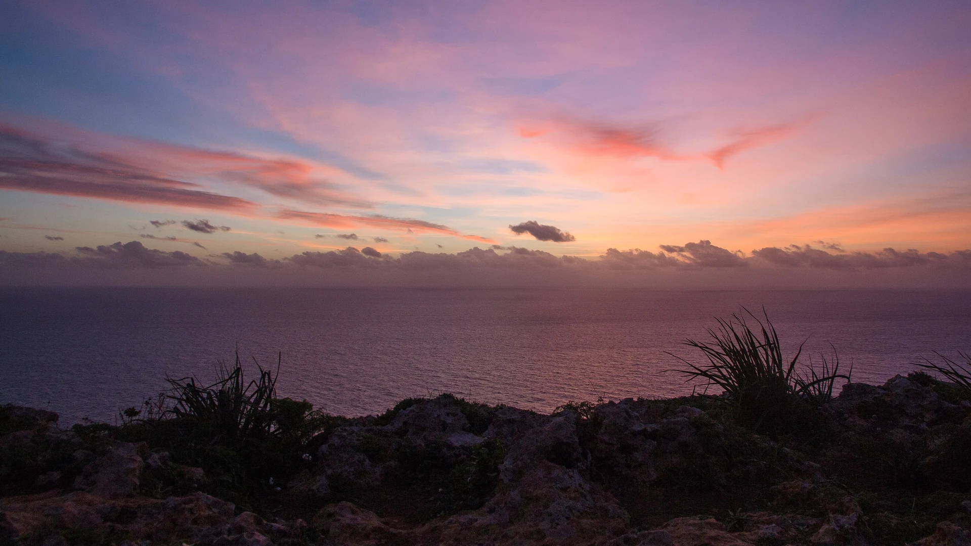 A pink and violet sunset over the Mediterranean from the Maltese coast – the setting for an adults-only break