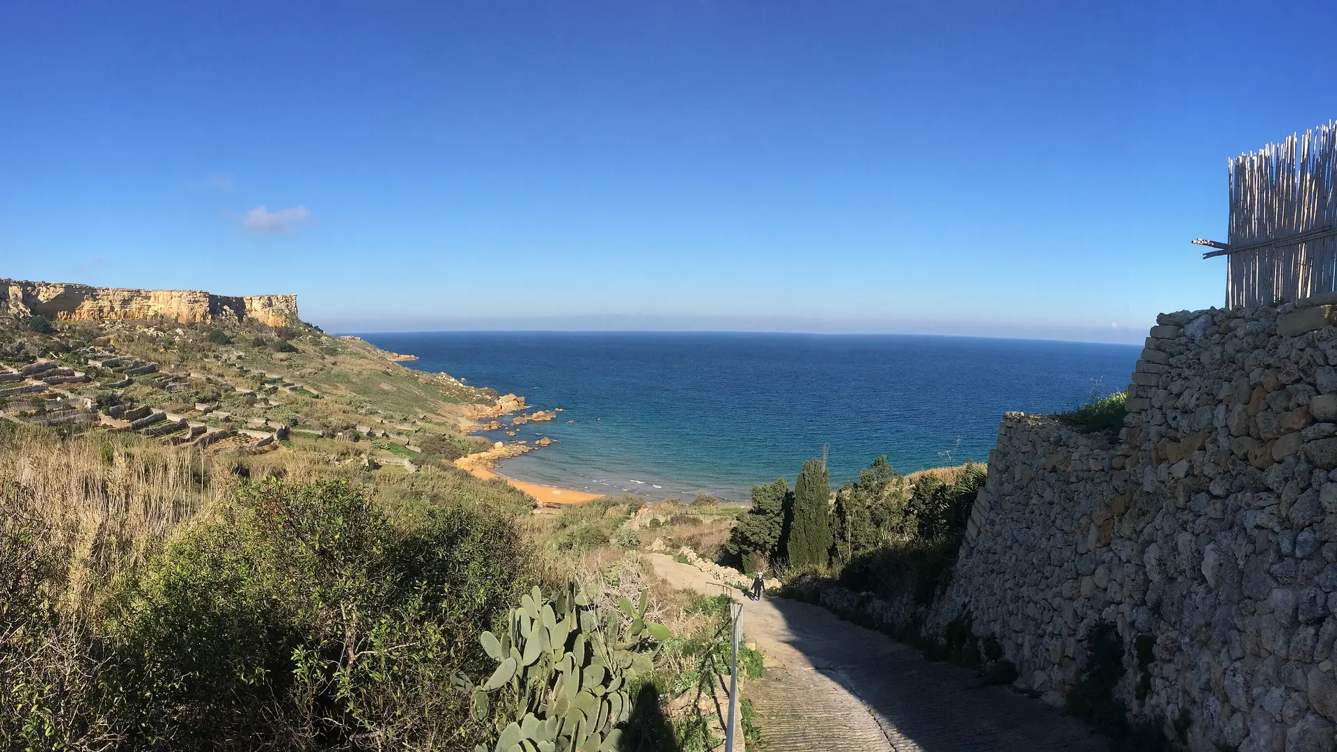 San Blas Bay on Gozo, with its distinctive reddish sand and clear turquoise water