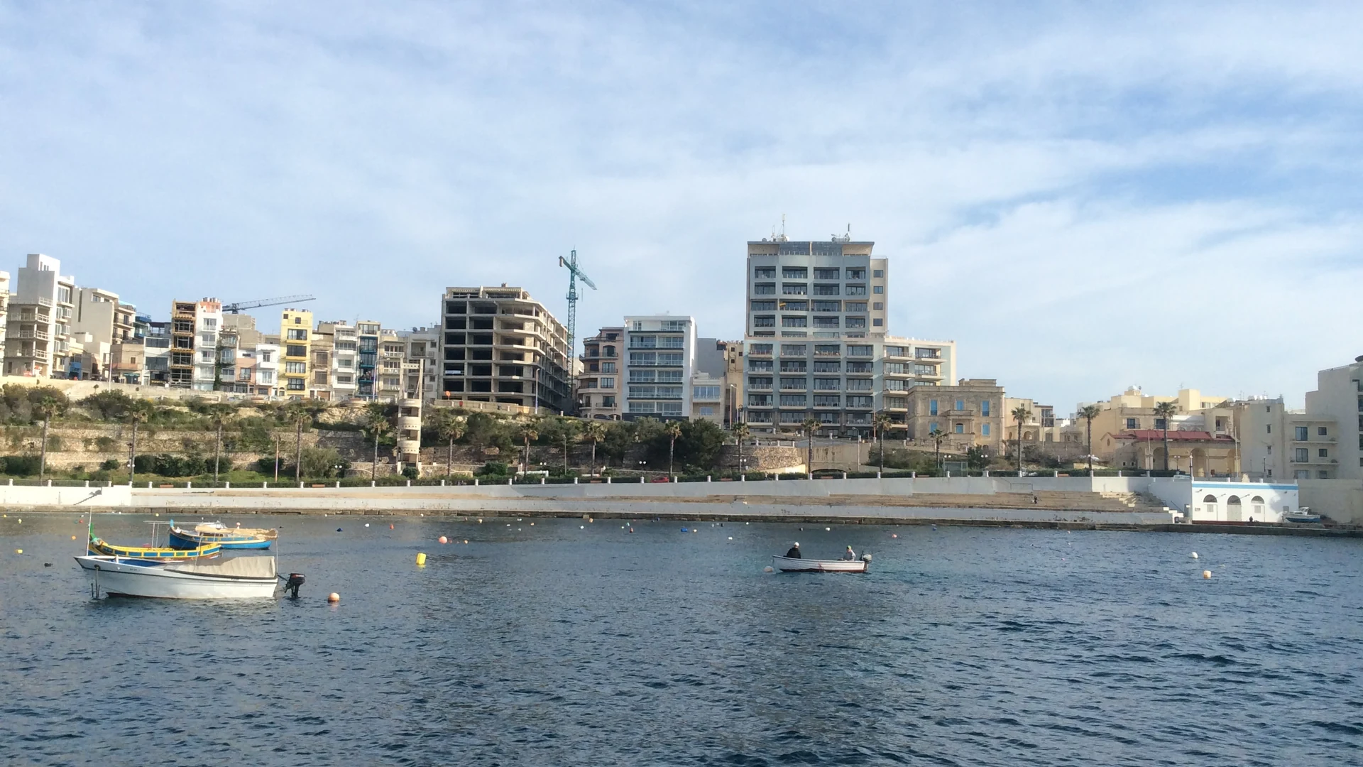 The seafront promenade at Bugibba, St Paul's Bay, Malta, lined with hotels and restaurants