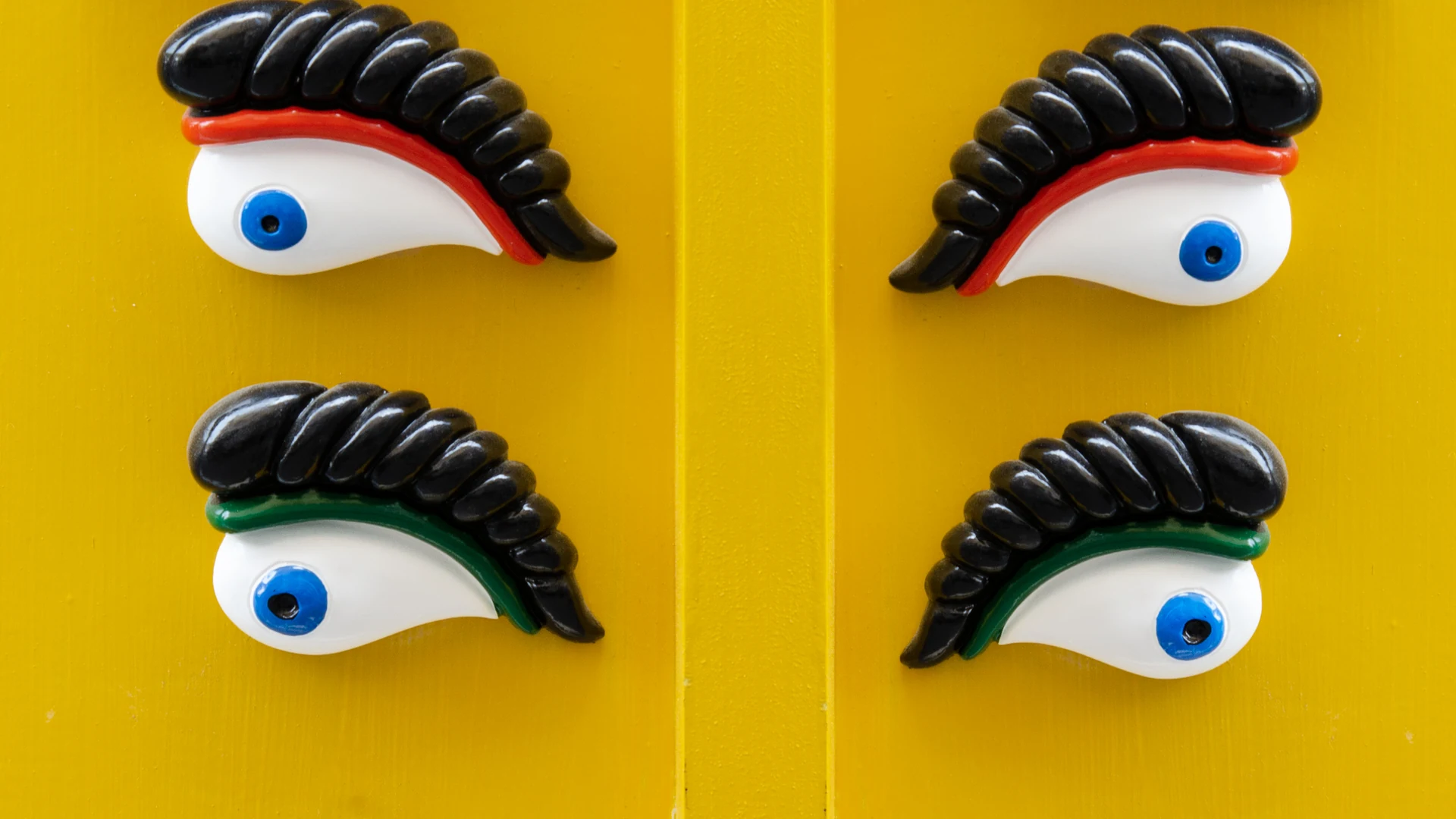 The distinctive painted eye on the prow of a traditional Maltese luzzu fishing boat on the sea
