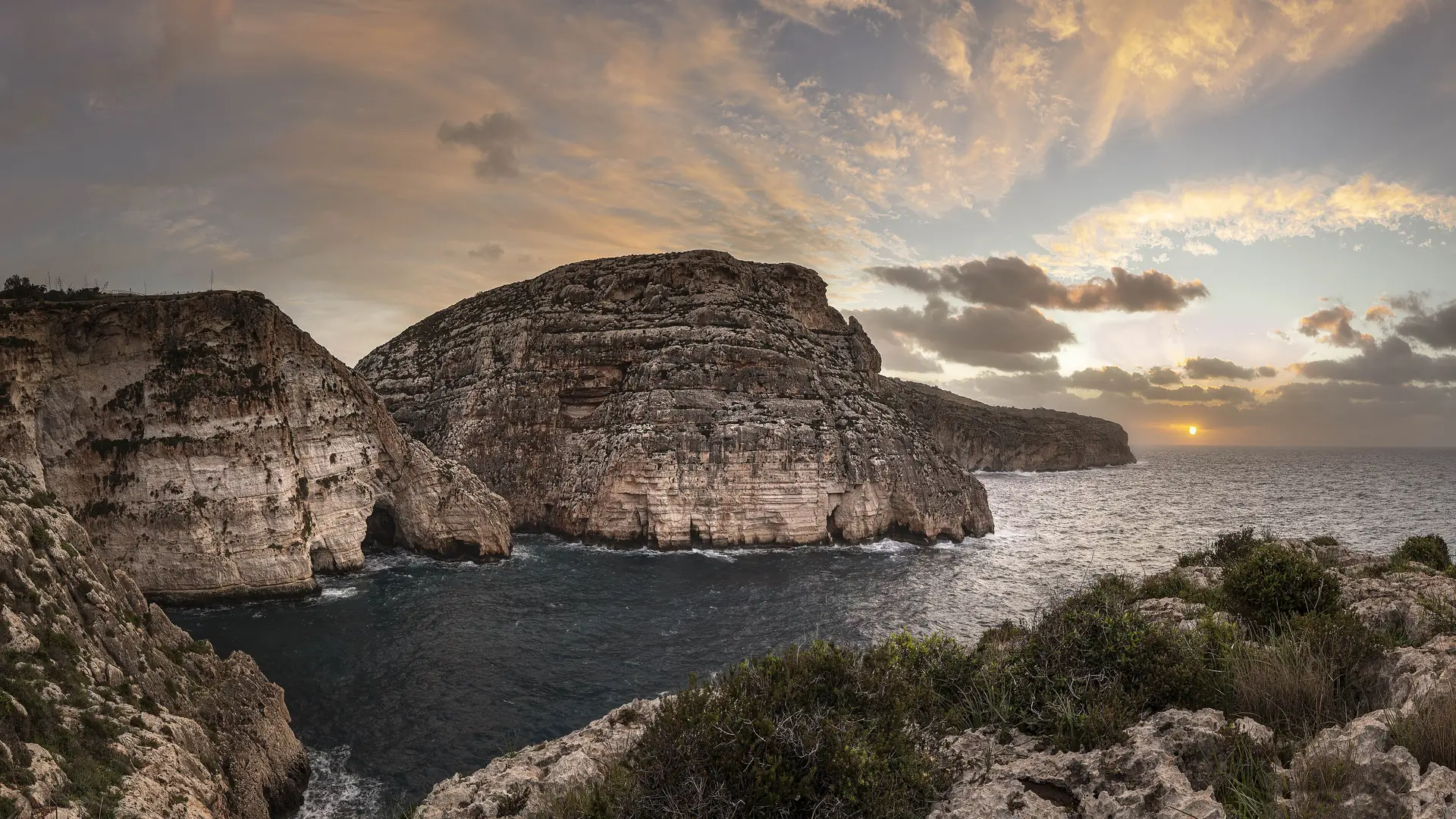 The rugged south-coast cliffs at Il-Munqar near Żurrieq, the kind of remote spot a hire car reaches