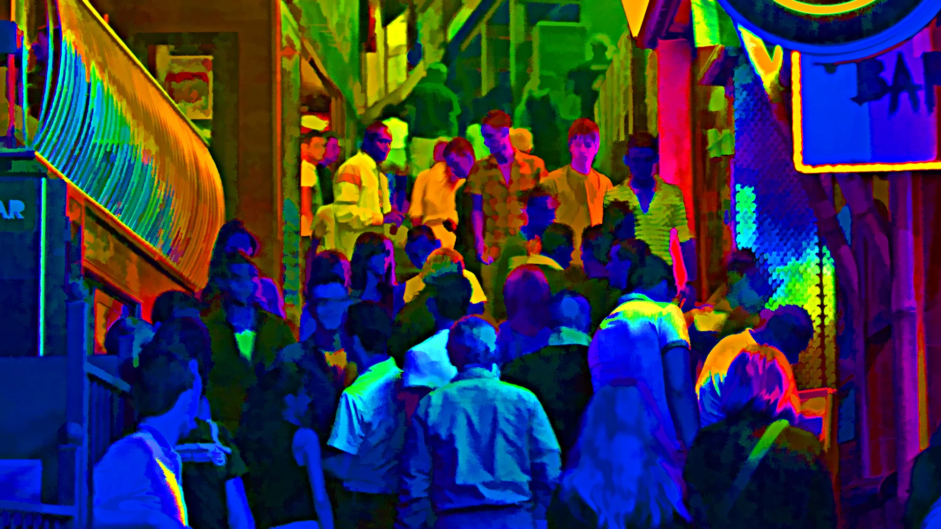 Busy nightlife street in Paceville, St Julian's, Malta at night with lit bars and crowds