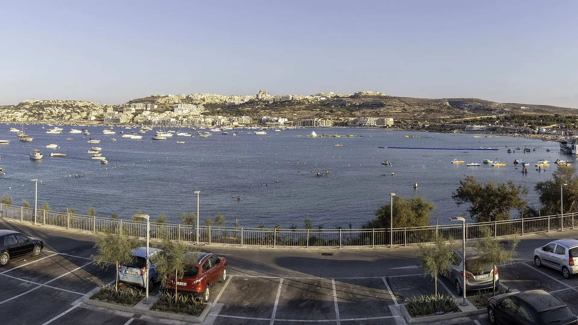 Mellieħa Bay stretching below the village – the area where Malta's swim-up room hotels cluster