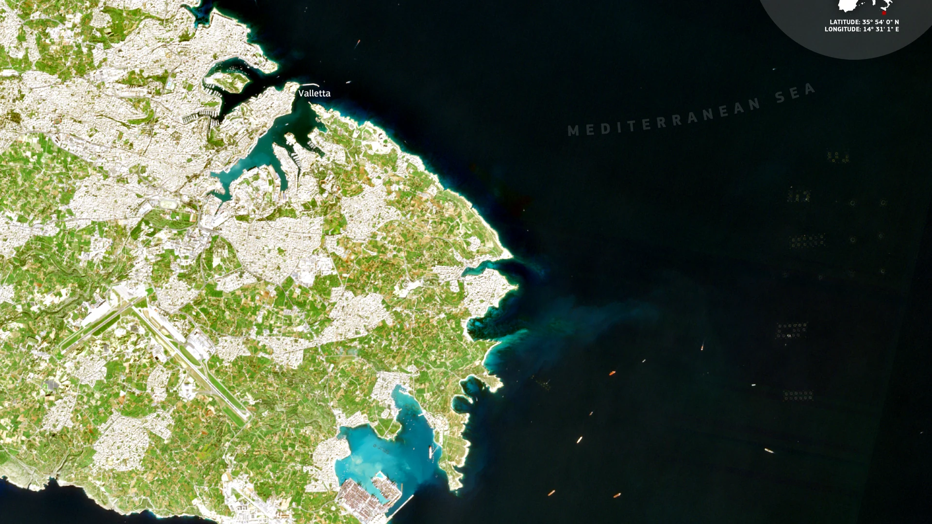 Satellite view of Malta and its islands from space, showing the golden limestone island surrounded by the blue Mediterranean Sea