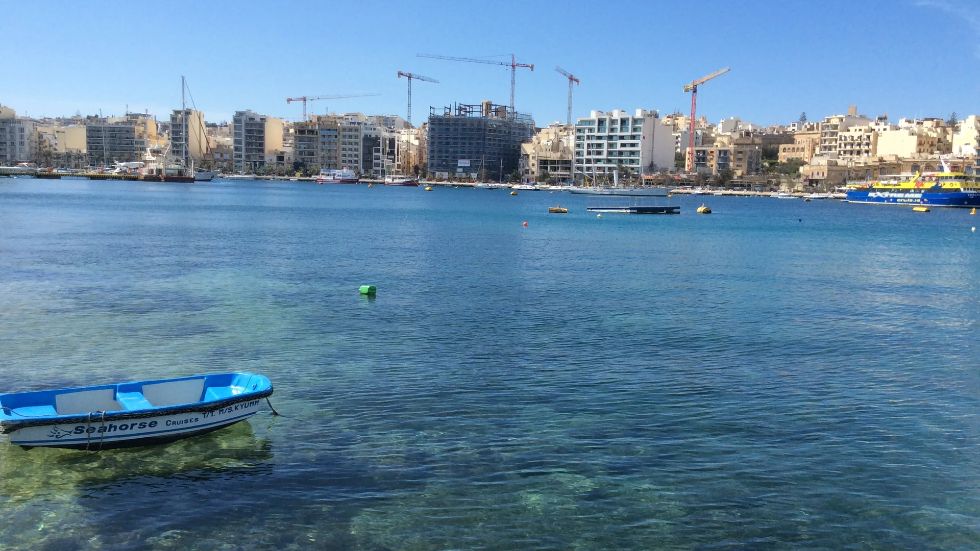 Apartment blocks and construction cranes along the Sliema and Gżira waterfront, Malta